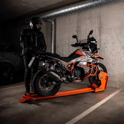 A motorcycle on a DockIT stand and a car sharing one underground parking space