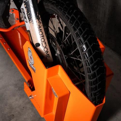 Front wheel of a motorcycle locked into the DockIT stand
