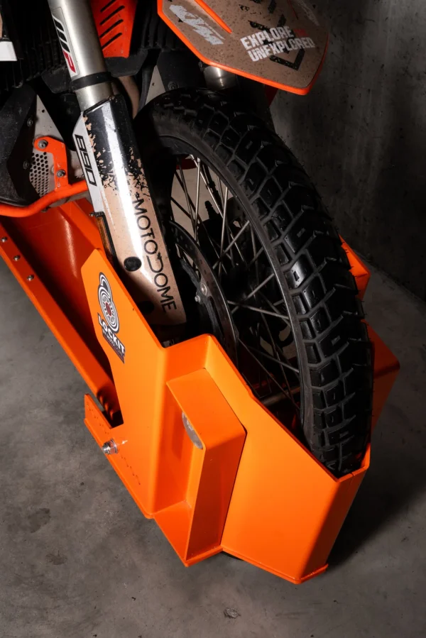 Front wheel of a motorcycle locked into the DockIT stand