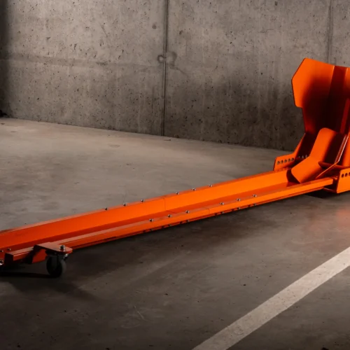 Orange DockIT rotating motorcycle parking stand on an underground car park floor