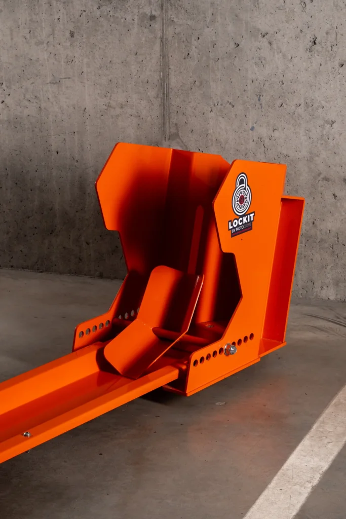 Orange DockIT motorcycle stand photographed on its own