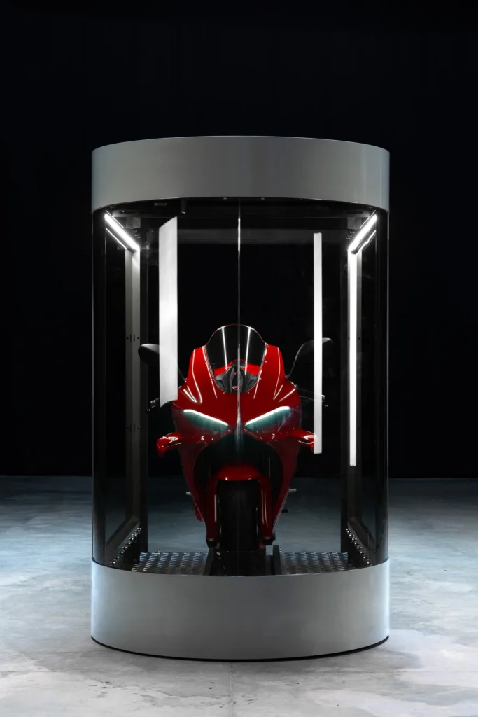 Front view through the tempered glass of a MotoDome with a red sportbike inside