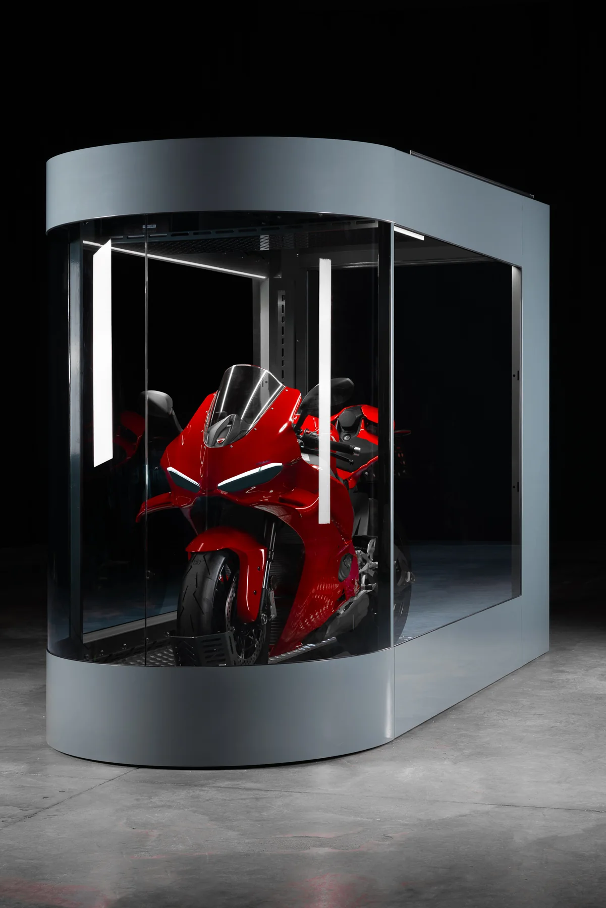 Interior of a MotoDome showing a red motorcycle under ambient LED lighting