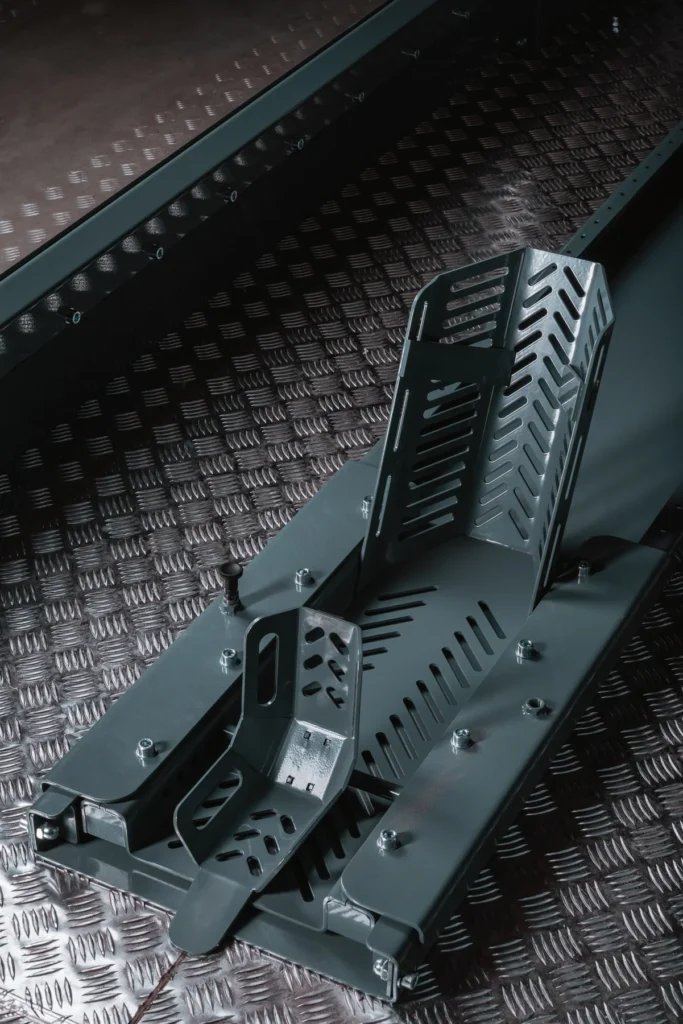 Checker plate floor and ride-in ramp of a MotoDome motorcycle garage